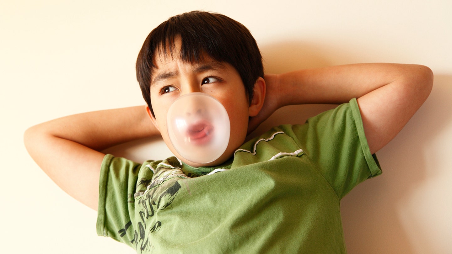 little boy blowing bubble