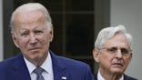 WASHINGTON, DC - MAY 13: Attorney General Merrick Garland looks on as U.S. President Joe Biden speaks in the Rose Garden of the White House on May 13, 2022 in Washington, DC. The event was held to highlight state and local leaders who are investing in American Rescue Plan funding to improve community safety. (Photo by Drew Angerer/Getty Images)