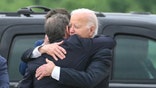 President Biden and Hunter Biden hugging.