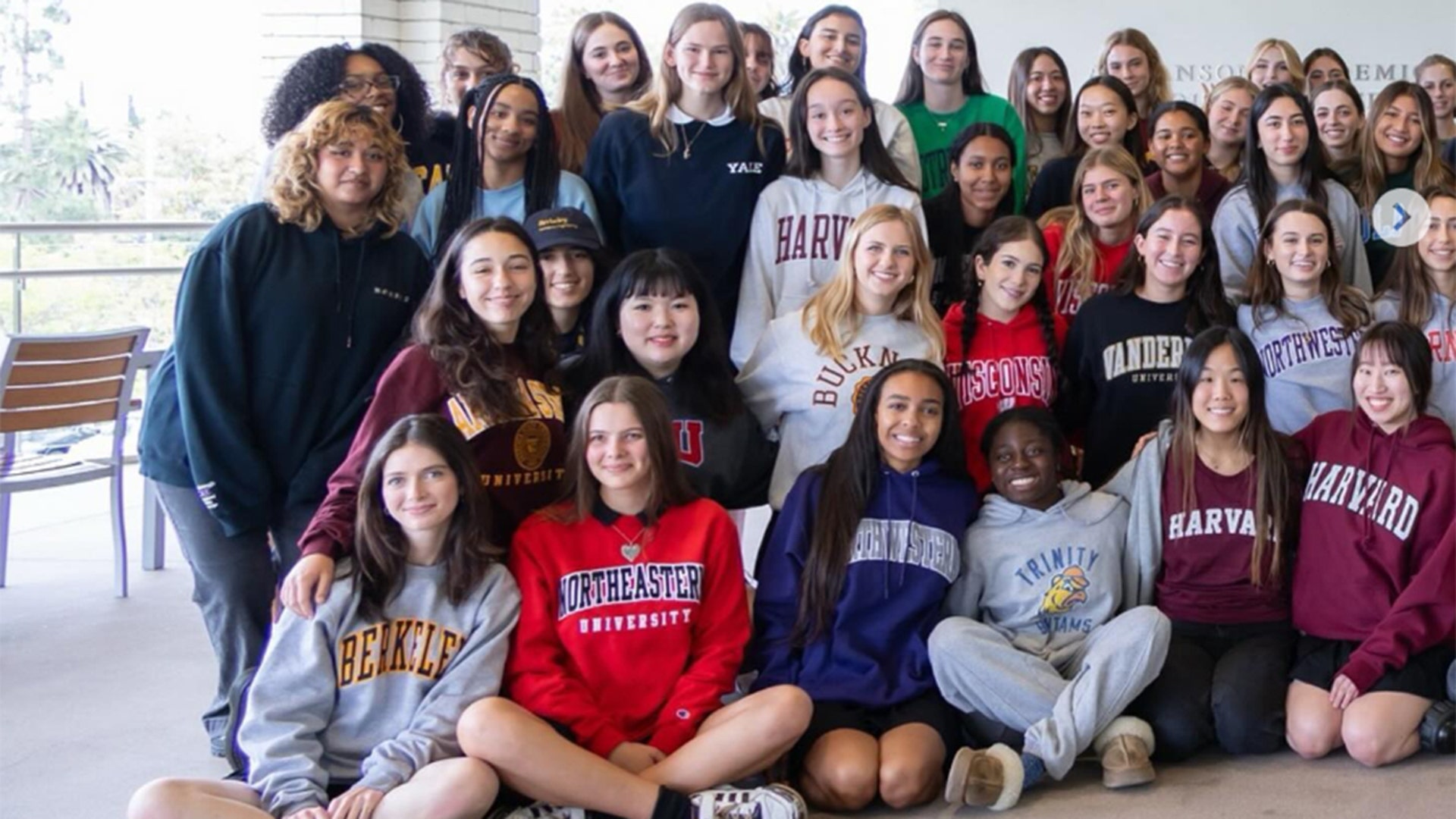 Violet Affleck with her class in a Yale sweatshirt.