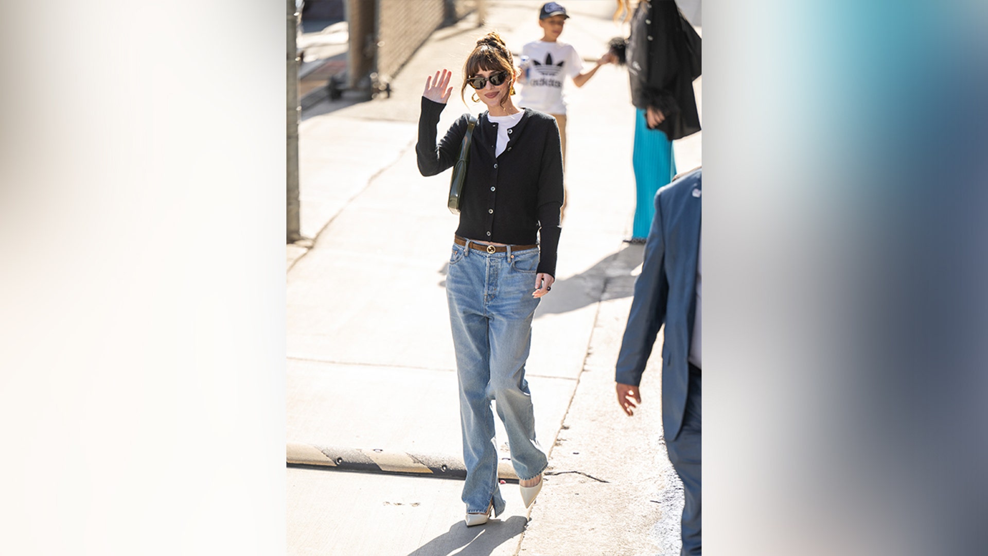 Dakota Johnson looked casual in jeans and a cardigan as she arrived to "Jimmy Kimmel Live!"