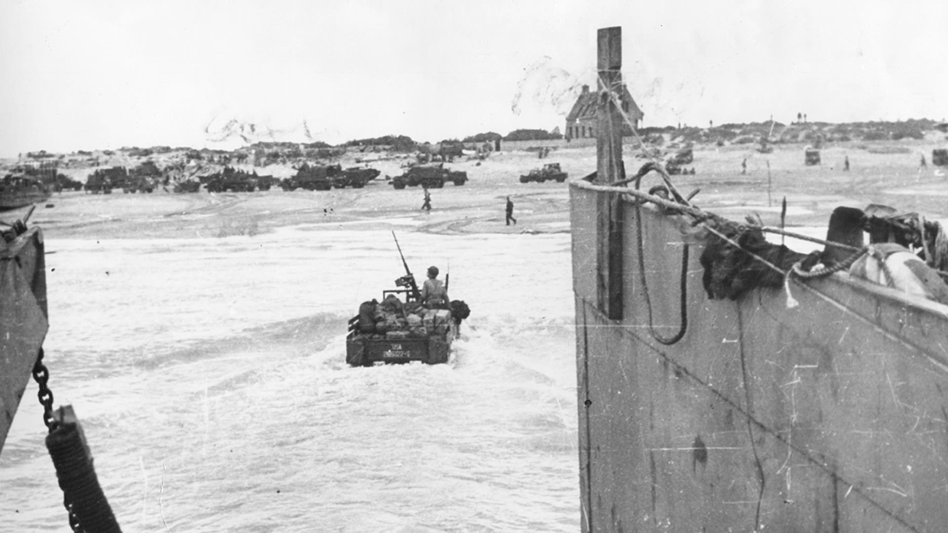 A weapon carrier moves through the surf towards Utah Beach, near Cherbourg, from its landing craft off the northern coast of France