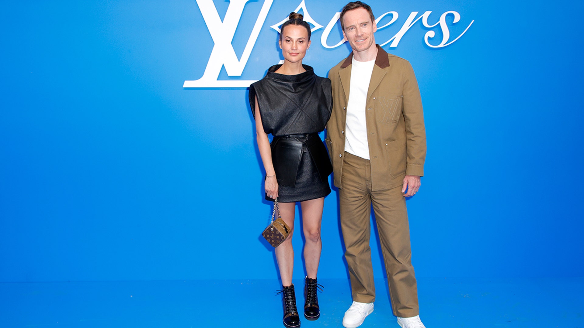Alicia Vikander and Michael Fassbender made a rare appearance on the red carpet together, at the 2024 Louis Vuitton show.