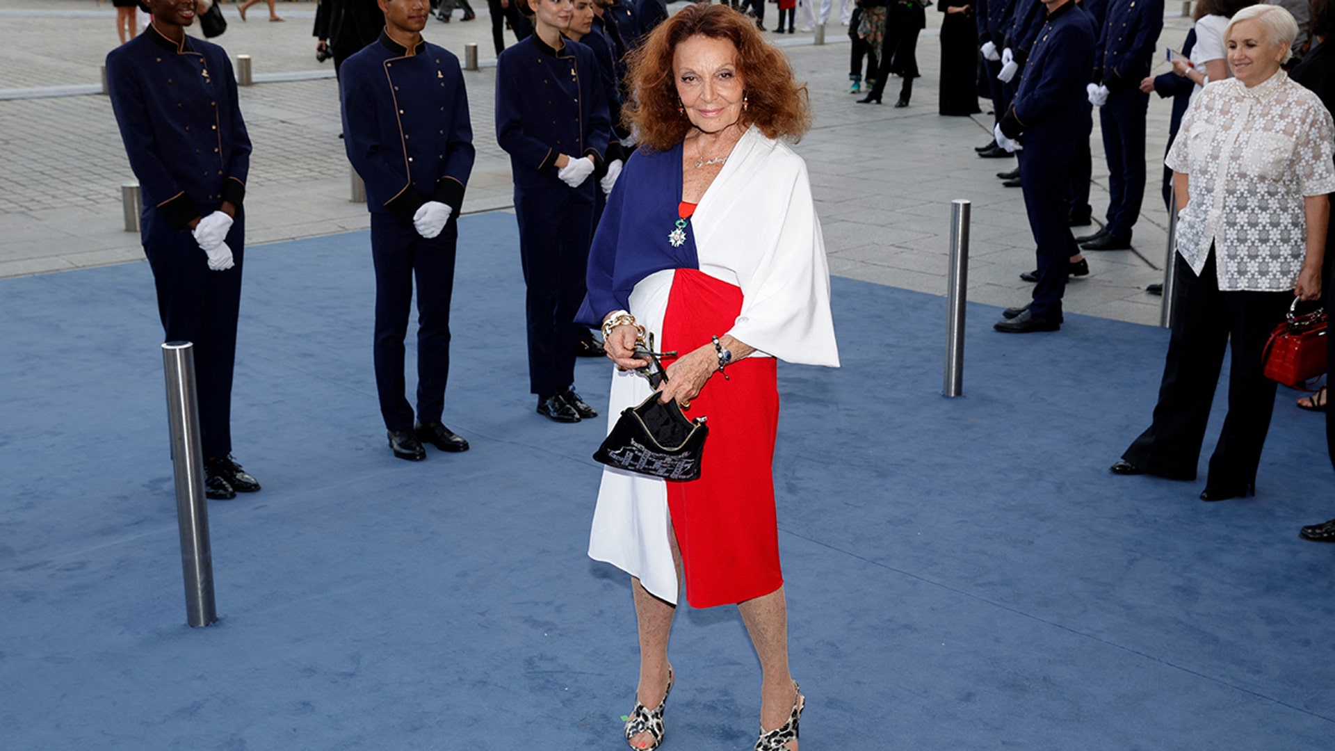 Diane von Furstenberg wore a white, blue and red dress to the red carpet at Vogue World red carpet, during Paris Fashion Week.