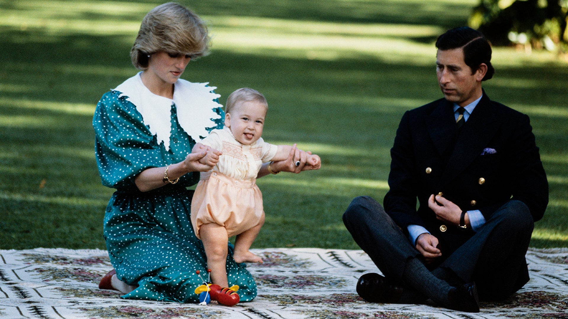 Prince William sticks his tongue out at photographers, as he and his parents posed for pictures in New Zealand in April 1983.