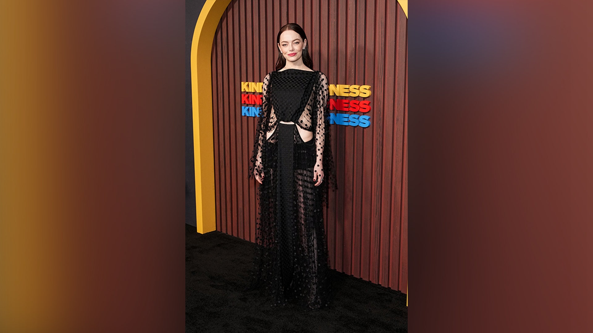 Emma Stone attended the "Kinds of Kindness" premiere in a sheer black Louis Vuitton dress with cutouts on the sides.