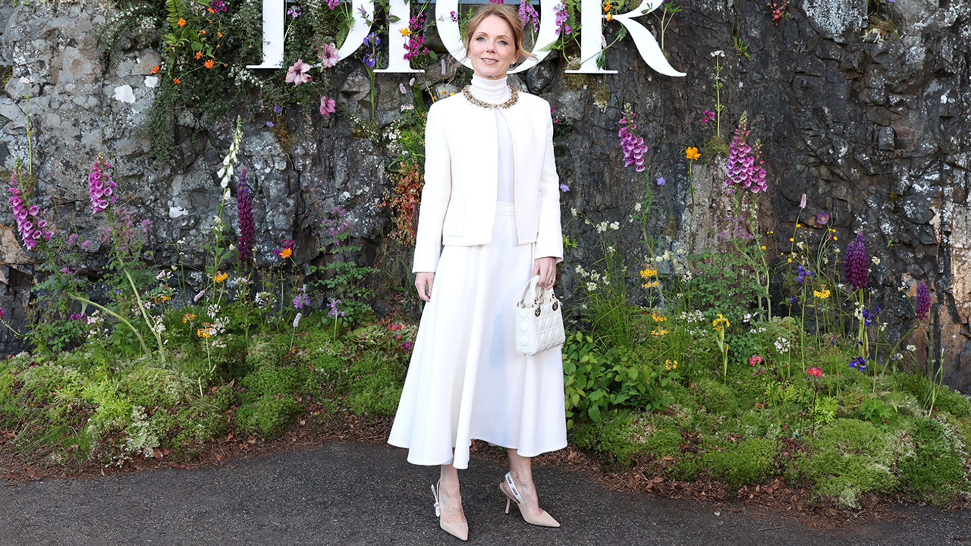 Geri Halliwell wore an all white ensemble to the Dior fashion show, and paired it with her Dior slingback heels.