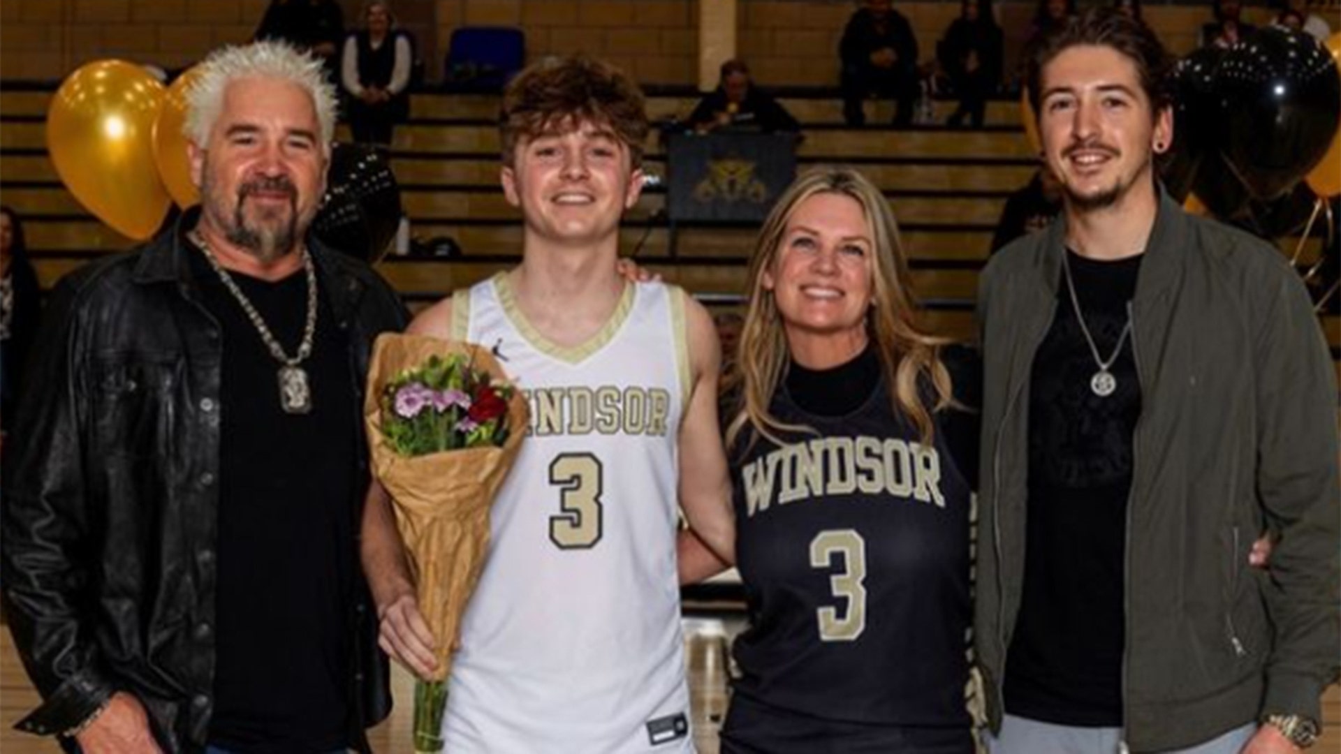 Guy Fieri and his family at Ryder Fieri's basketball game.