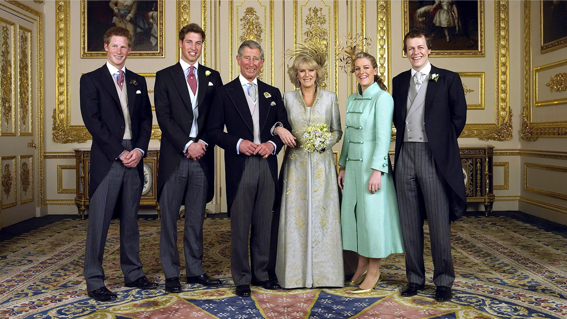 Prince William posing with his brother, father and step-mom on his dad's wedding day, in 2005.