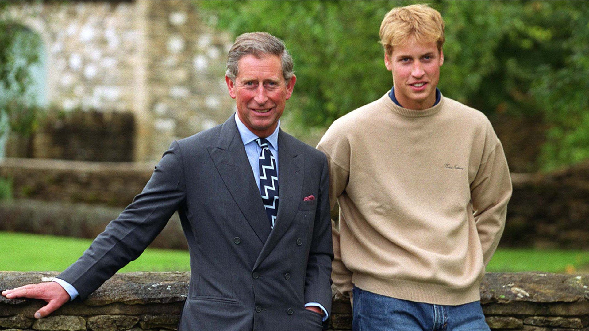 Prince William posing with King Charles III in 2000.