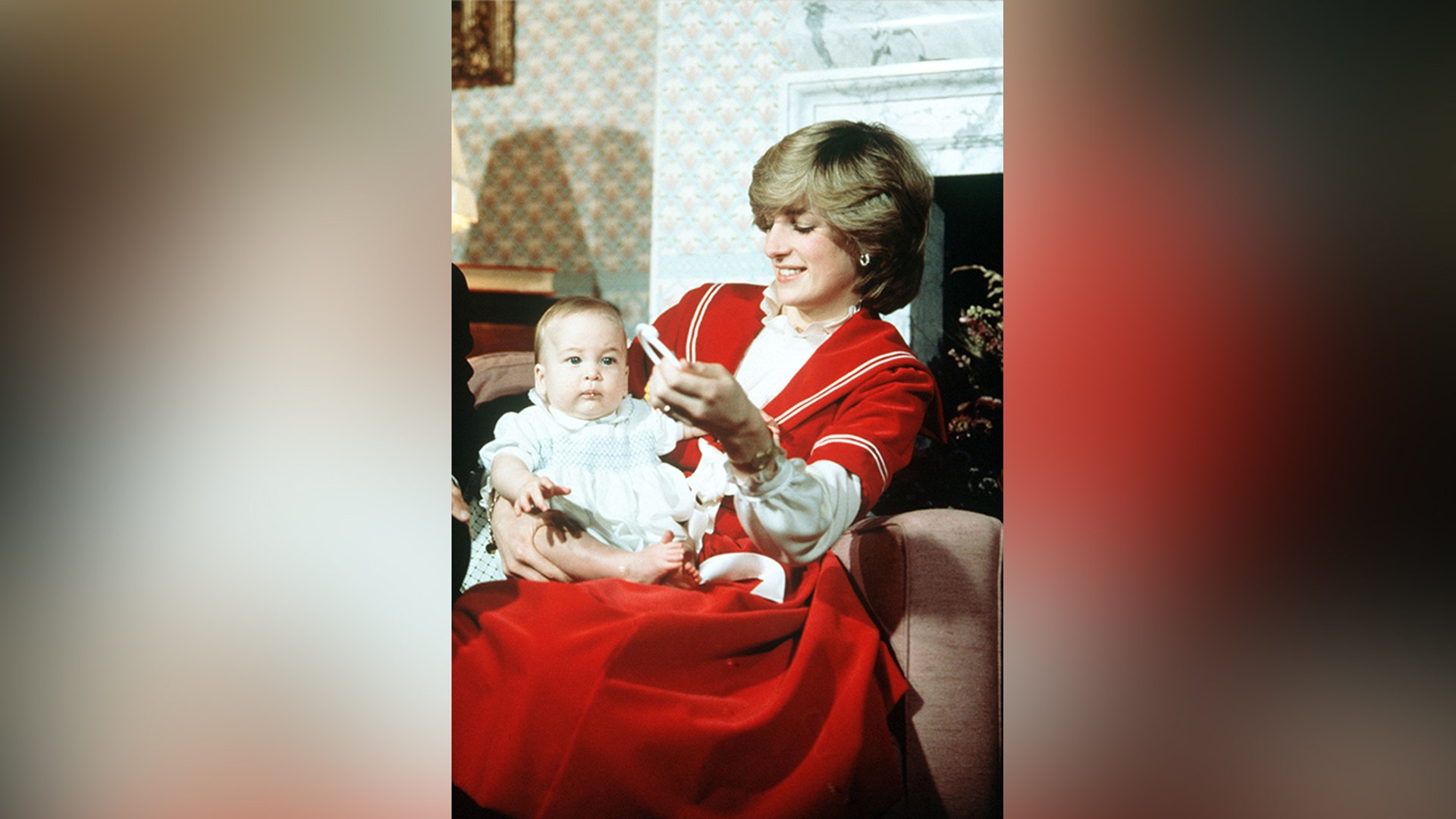 Princess Diana cradling Prince William in December 1982.