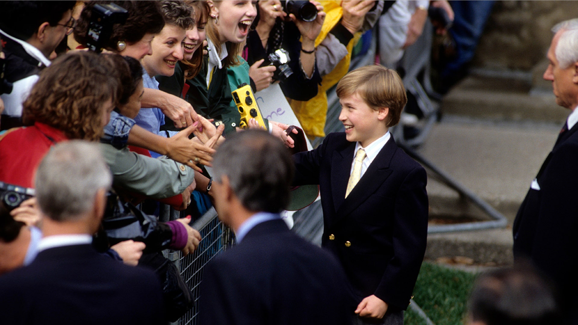 Prince William shaking hands with the public in 1991, at 9 years old.