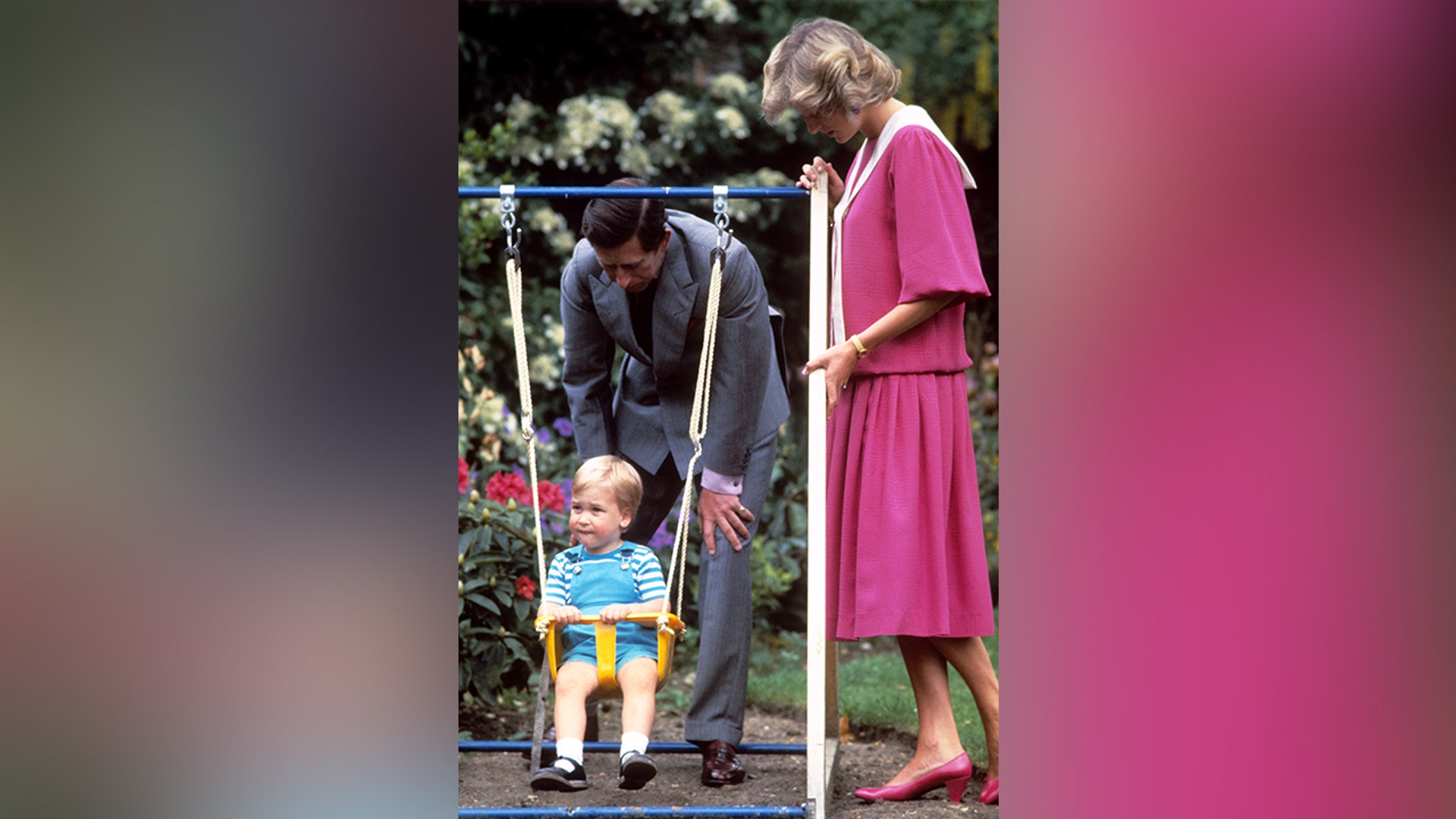 A pregnant Princess Diana looks on as King Charles pushes Prince William on a swing in 1984.