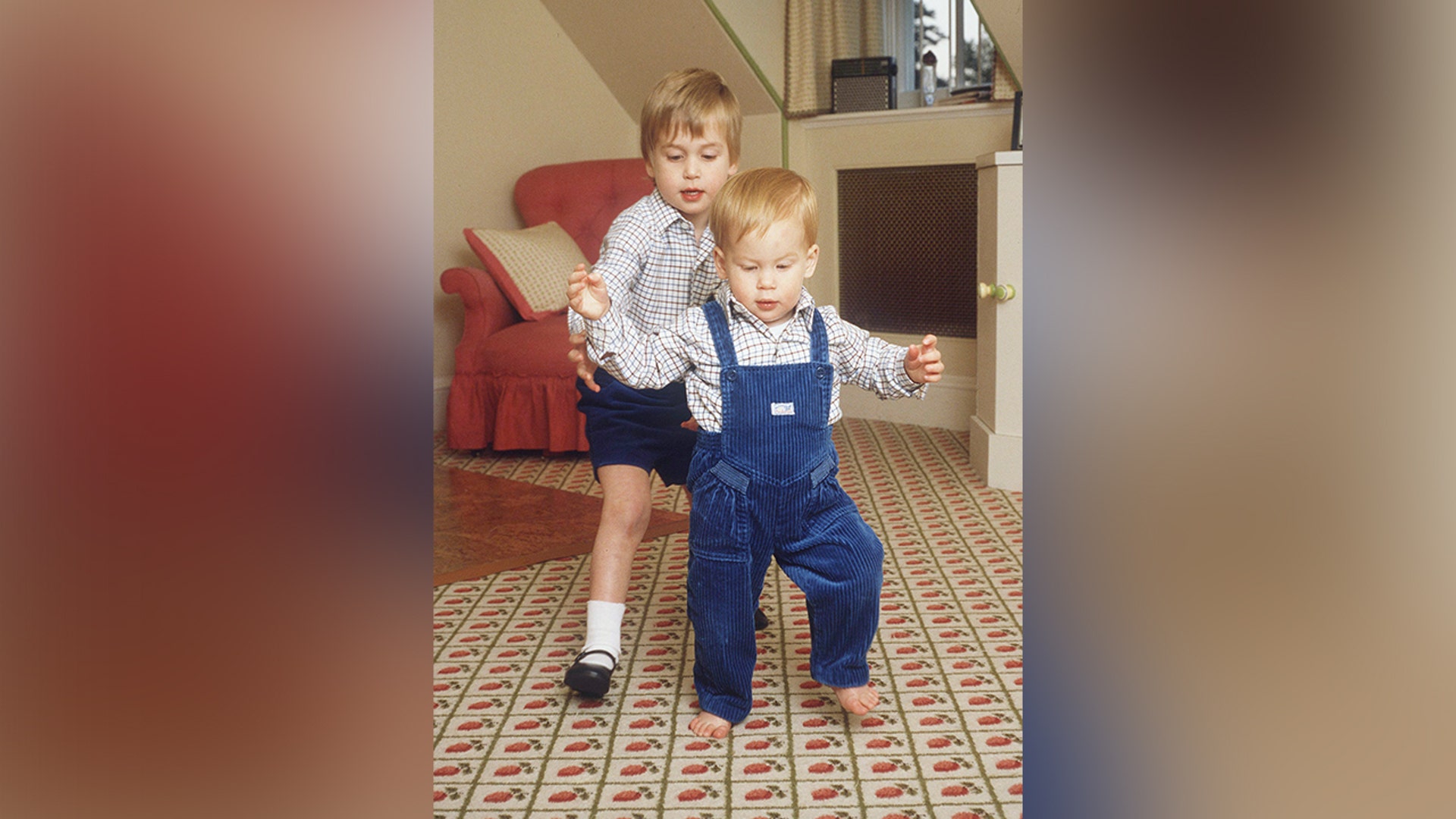 Prince William helped his baby brother as he took his first steps in 1985.