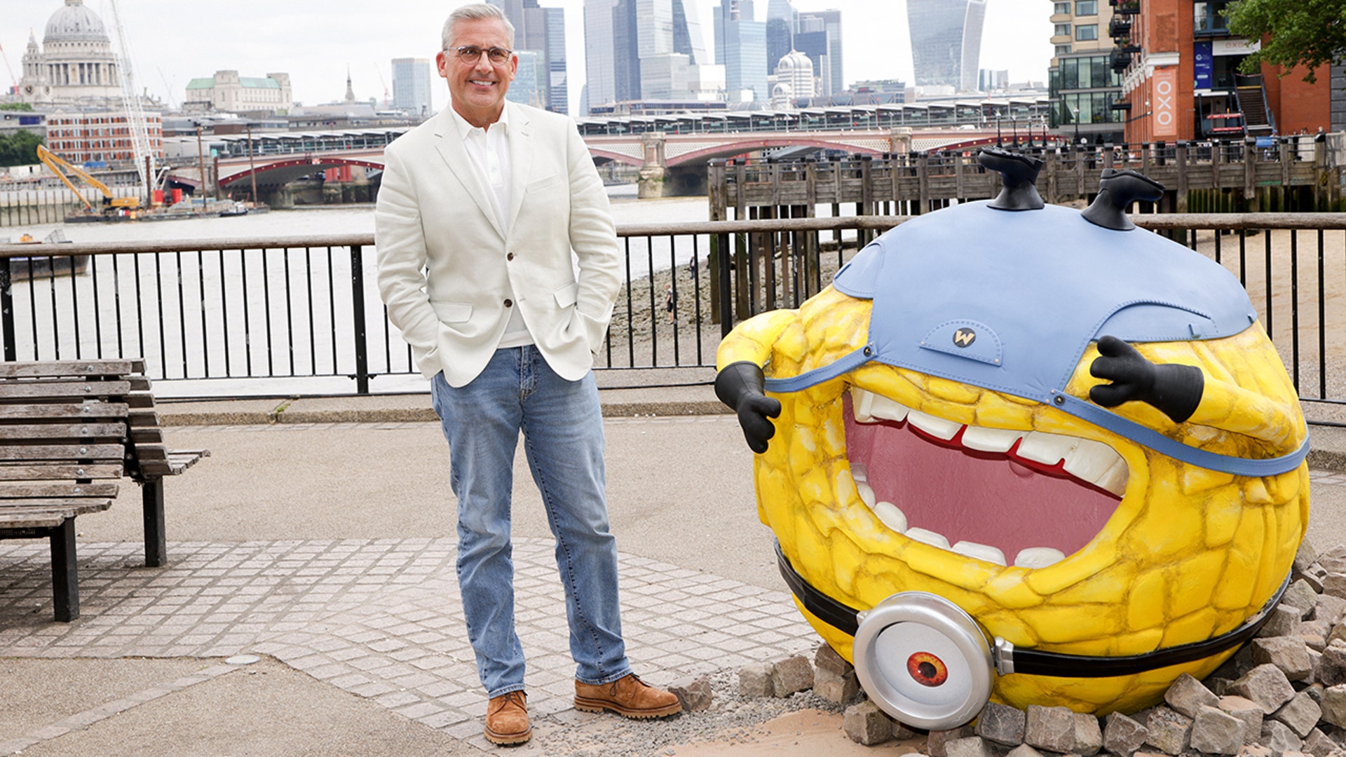 Steve Carell posed next to a minion in jeans and a white suit jacket, while at a media event for "Despicable Me 4."