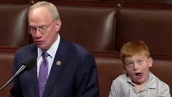 Congressman's House floor speech goes viral after son steals show with silly faces