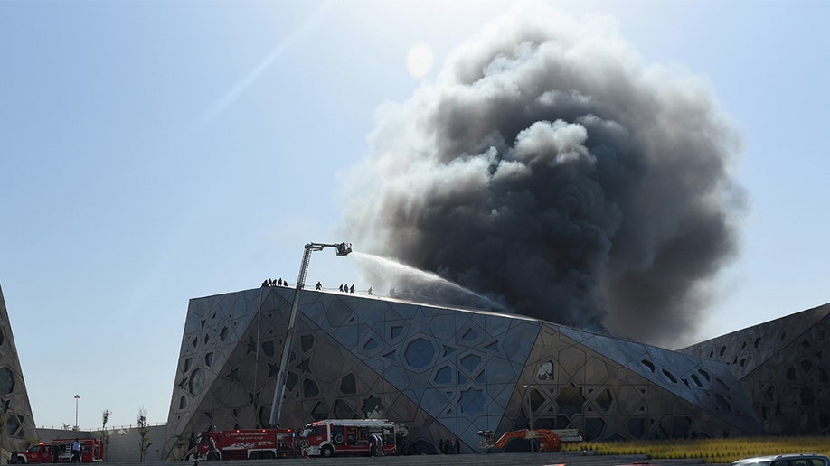 Firefighters respond to a building fire in Kuwait.