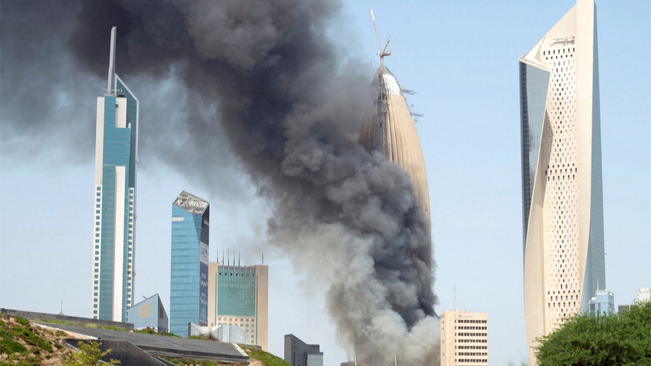 Smoke rises in a building during a fire in Kuwait.