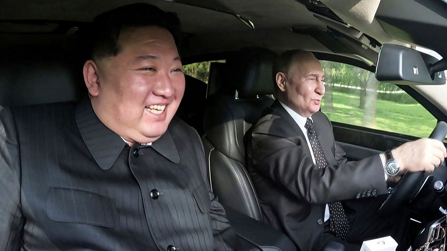Putin and Kim driving car