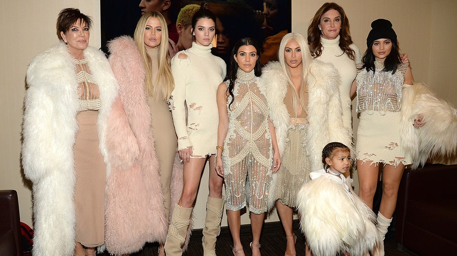 Kim Kardashian leads family in white ensembles at Kanye West show.