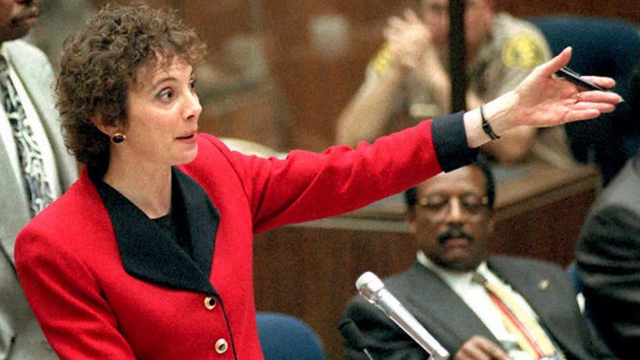 Lawyer Marcia Clark wears a red suit in court on OJ Simpson trial.