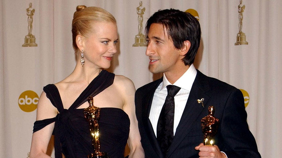 Nicole Kidman and Adrian Brody holding Oscars