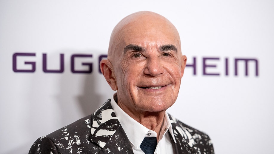 Robert Shapiro wears geometric blazer