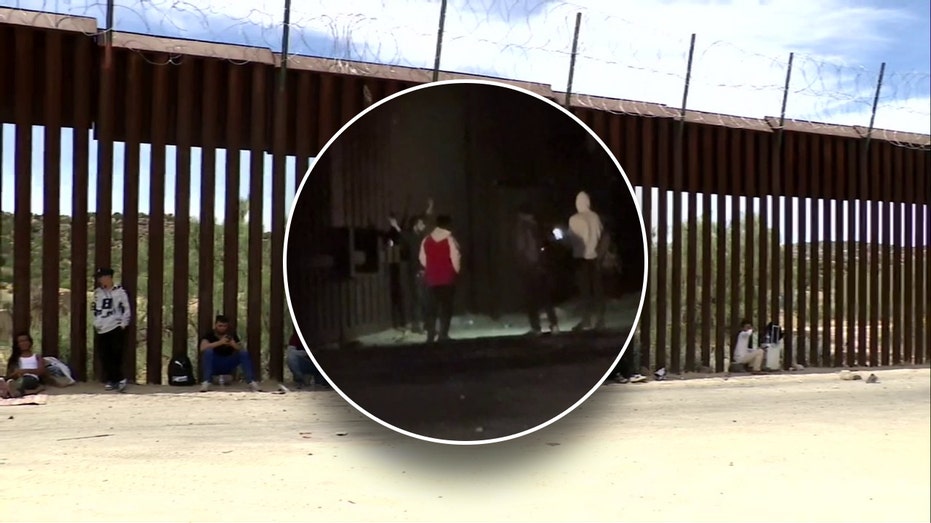 Migrants crossing illegally into California snap photos at border wall