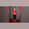 Emma Stone wore a red sweater over a blue collared shirt, paired with ankle length black pants to the UK Special Screening of Searchlight Pictures' "Kinds of Kindness."