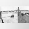 A weapon carrier moves through the surf towards Utah Beach, near Cherbourg, from its landing craft off the northern coast of France