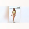 Brooke Burke was photographed while posing for photos in a yellow bikini in Malibu.