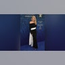 Christie Brinkley arrived at the Fragrance Foundation Awards in a black an off-the-shoulder Solace London gown, with a white sash tied in the middle.