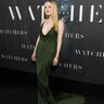 Dakota Fanning wore a plunging forest green Loewe dress with gold chain straps.