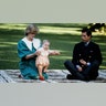 Prince William sticks his tongue out at photographers, as he and his parents posed for pictures in New Zealand in April 1983.