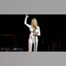 Dolly Parton kicked off CMA Fest with a panel, in which she wore a matching white long-sleeve and pants, with bedazzled chains attached throughout.