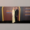 Kirsten Dunst wore a yellow dress with a flower detail, and Jesse Plemons wore a black suit to the premiere of "Kinds of Kindness."