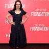 Julia Louis-Dreyfus posed for photos on the red carpet at the SAG-AFTRA Foundation Conversations for her movie "Tuesday," in a button-up black dress with puffed sleeves and a synched waist.