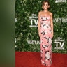 Kristen Wiig posed for photos at the Gotham Awards in a strapless pink floral Emilia Wickstead dress.