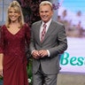 Vanna White and Pat Sajak wearing red and gray