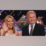 Vanna White and Pat Sajak smiling