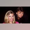 Vanna White and Pat Sajak posing for the camera