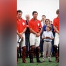 Prince William looking up to his father while at a polo match in 1990.