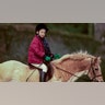 Prince William practiced horse riding near Sandringham Estate in January 1990.