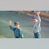 Prince Harry and Prince William waving to fans