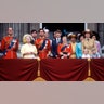 The Queen stood on the trooping balcony with her husband and grown children.