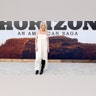 Sienna Miller stunned in a flowy white Chloe dress with lace and ruffles on the red carpet at the premiere of "Horizon: An American Saga - Chapter 1," pairing the dress with knee-high black boots.