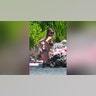 Sweeney wore a black bathing suit with white flowers on it for some summer fun.