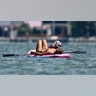 Sweeney gave her dog some love, as they both lounged on the paddleboard.