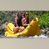 Sydney Sweeney and her friend on an inflatable banana