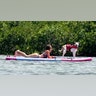 Sweeney took some time to relax with her dog while on a paddleboard.